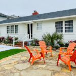 cottage exterior with 4 Adirondack chairs