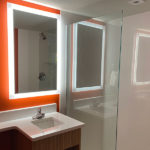 guest room bathroom with shower and vanity