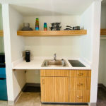 kitchenette area in queen bed suite